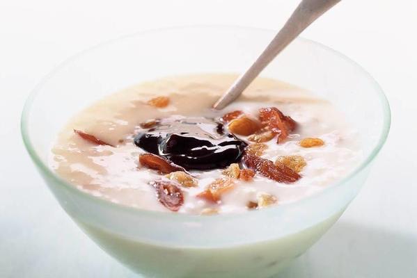rice pudding with tropical fruits and syrup