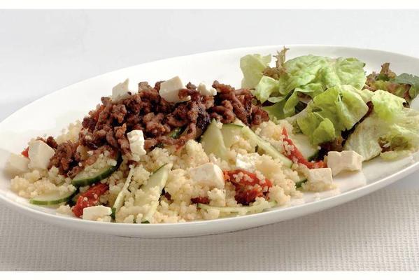 Moroccan couscous with minced meat and white cheese