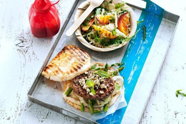 hamburger with grilled vegetables, hummus and white cheese