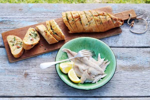trout in newspaper with barbecue loaf