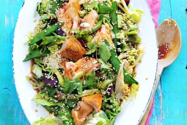 meal salad with quinoa, soy, salmon and japanese stir-fry