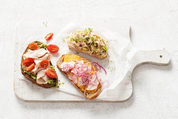 white bread with salmon, dairy spread and cress