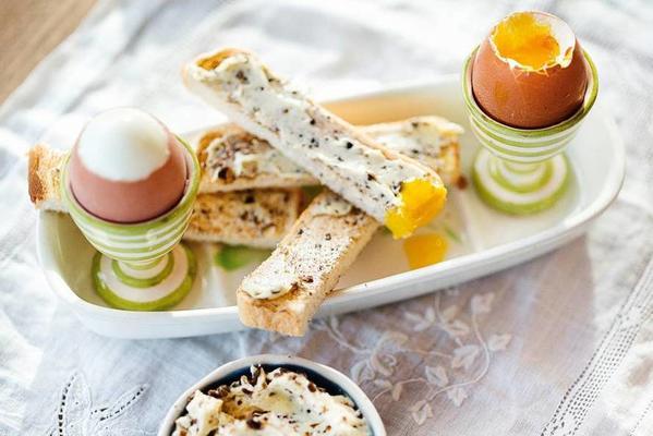 boiled egg with bread soldiers and truffle butter