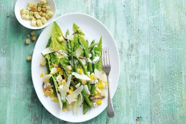 Caesar salad with green asparagus