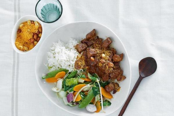 homemade satay with rice and stir-fried vegetables