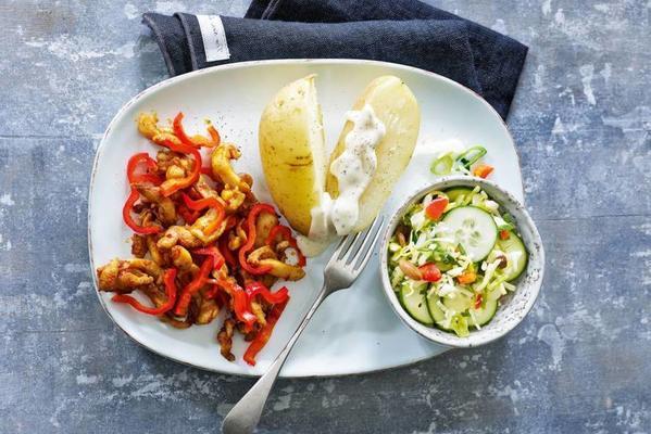 chicken strips with baked potato and raw vegetables