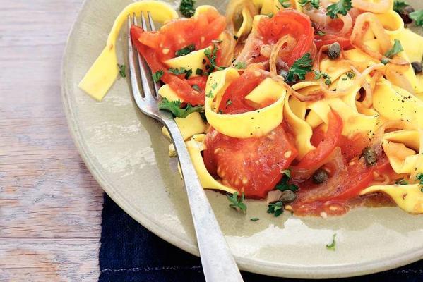 fresh ribbon pasta with tomato and capers