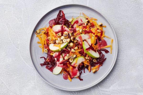 beetroot salad with carrot, apple and hazelnuts