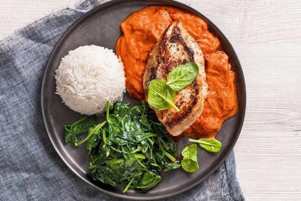 soft chicken tikka masala with wild spinach and rice