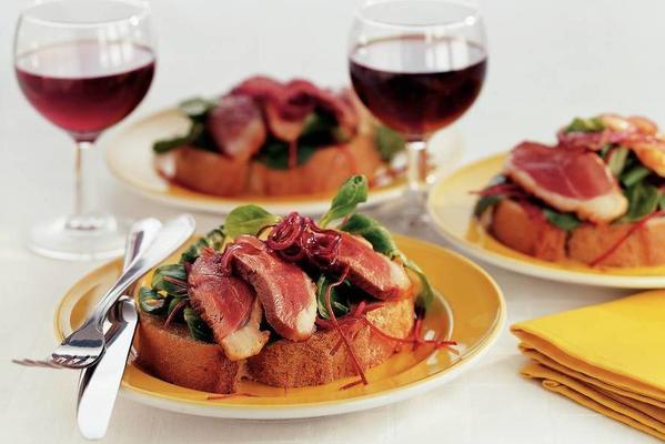 open sandwich with duck breast and red onions marmalade