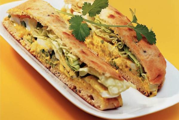 naan sandwich with curry salad and egg
