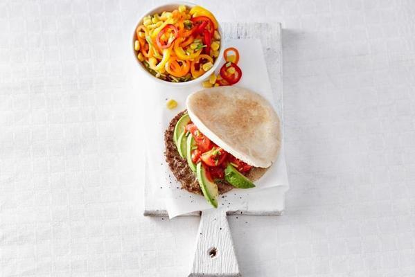 pitta burger with avocado and corn pepper salad