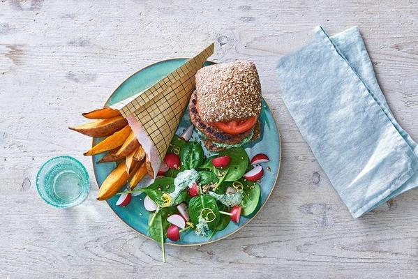 hamburger with spinach salad and sweet potato fries