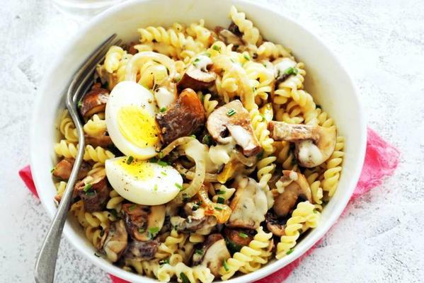 fusilli with mushroom sauce and a boiled egg