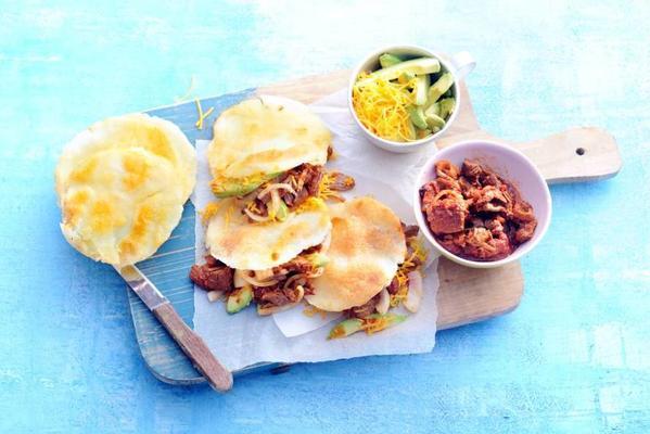 arepas filled with spicy pork and onion