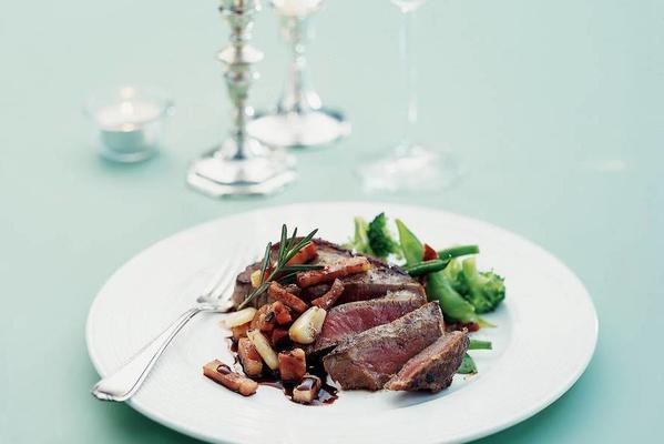 sirloin steak with red wine caramel and roasted garlic