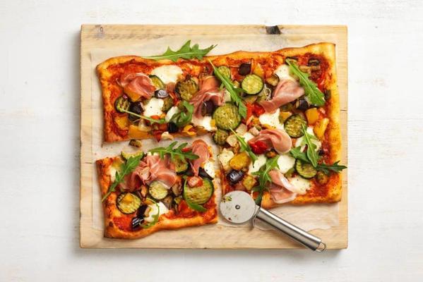 plate pizza with grilled vegetables and prosciutto