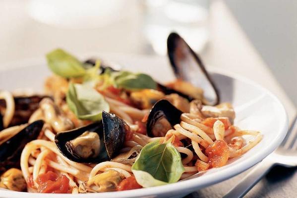 spaghetti with spicy tomato mussel sauce and basil