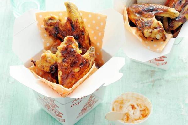 barbecue chicken wings with a dip of crème fraîche