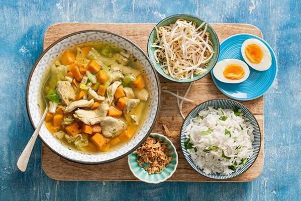 fragrant indonesian meal soup with rice and an egg