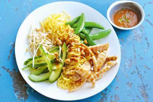 thai dish with chicken, noodles and peanut dressing