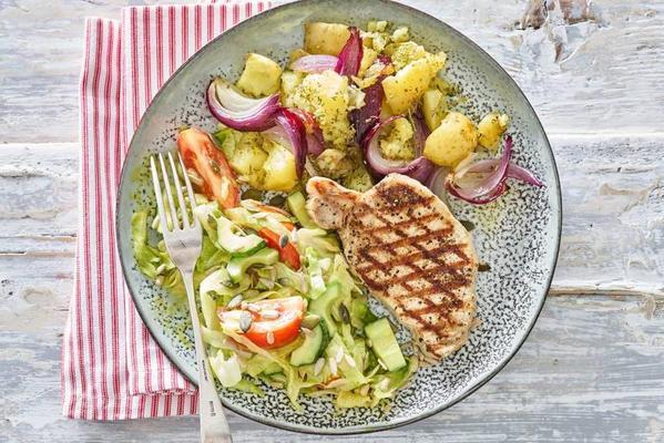 grilled fillet steak with potatoes and fresh salad
