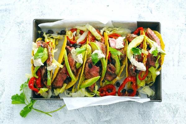tacos with spicy beef strips and beans