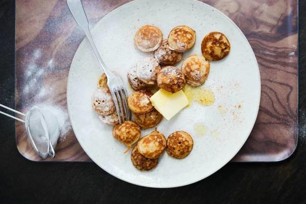 poffertjes with cinnamon, butter and icing sugar