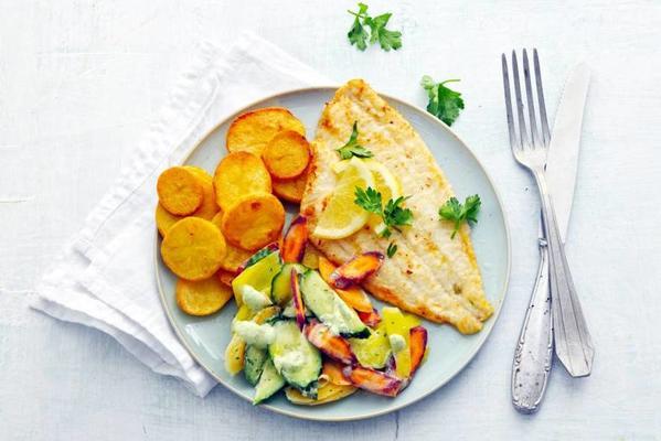 plaice fillet with baked potatoes and carrot salad