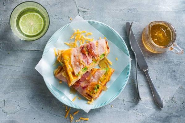 cheese waffle with avocado, cheddar and breakfast bacon
