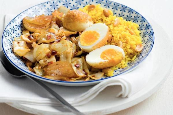 oriental cabbage dish with egg and yellow rice