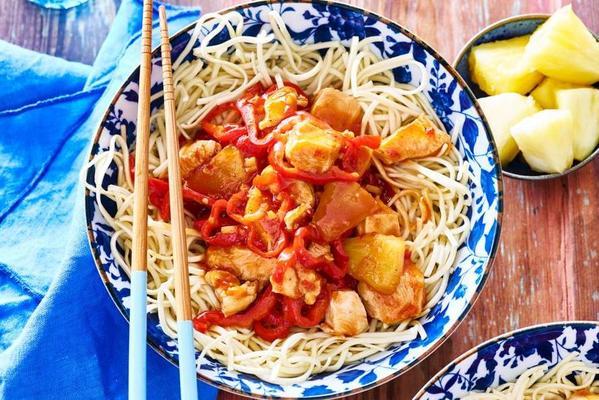 chicken in sweet and sour sauce with noodles and pointed pepper
