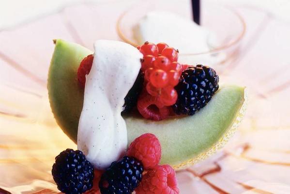 melon with red fruit and vanilla cream