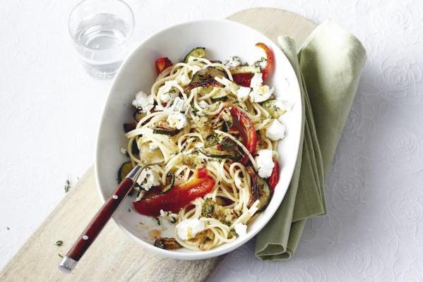 spicy spaghetti with vegetables and goat cheese