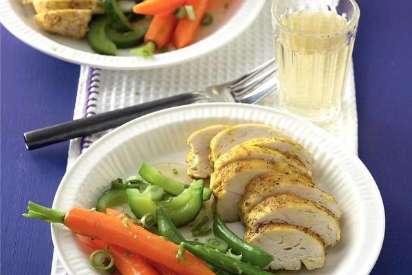 steamed vegetables and chicken fillet with curry dressing