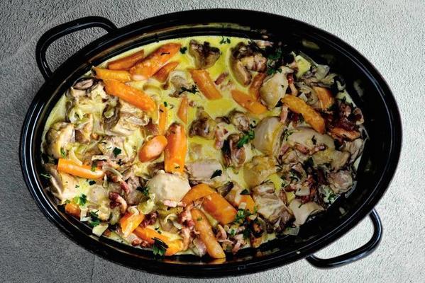 chicken stew with carrot, bacon, potatoes and chestnut mushrooms