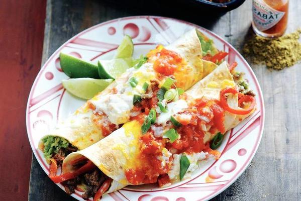 stuffed tortillas with minced meat and tomato sauce