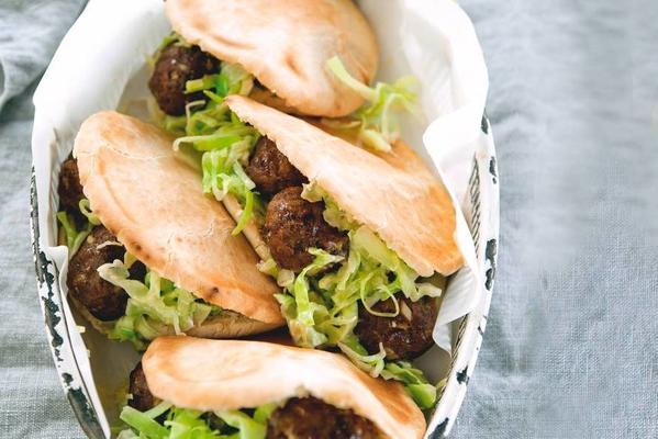 meatballs on bread with pointed cabbage