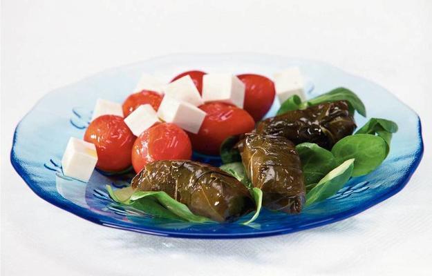 Greek dolmas with tomato salad