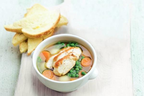meal soup with spring vegetables and chicken