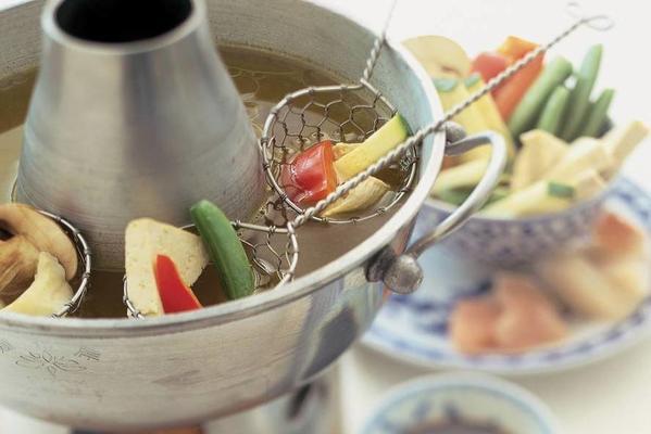 bouillon fondue with chicken, fish and vegetables