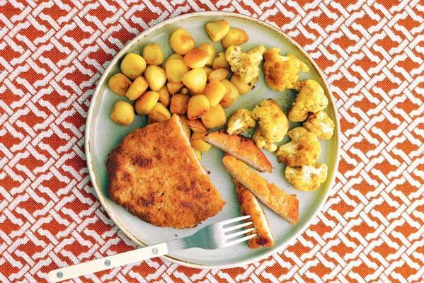 schnitzel with baby potatoes and curry cauliflower
