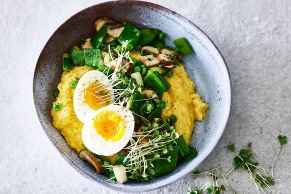 creamy polenta with fresh peas and a boiled egg