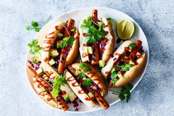 asian hotdog with red cabbage, avocado and tahindressing