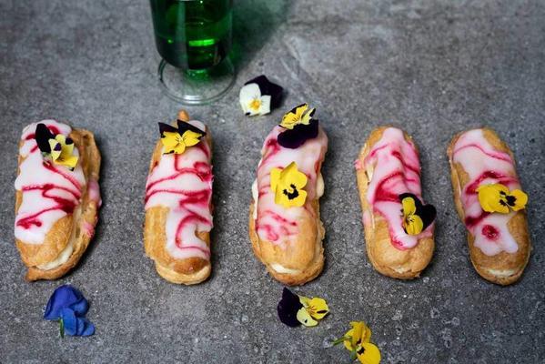 pink eclairs with edible flowers