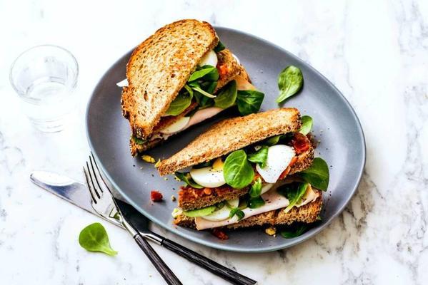 wholemeal club sandwich with chicken fillet, lettuce and egg