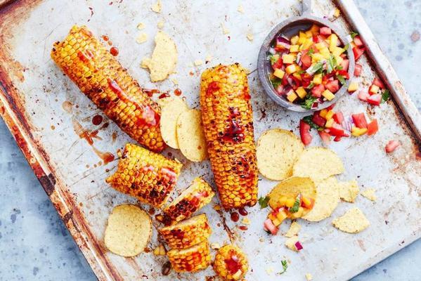 corn cobs from the bbq with mango salsa