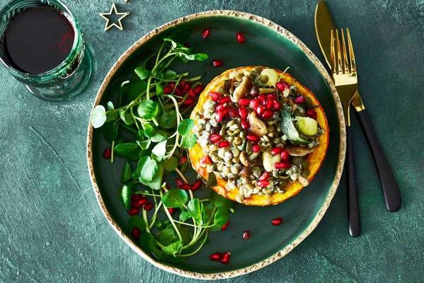 richly filled pumpkin with lentils, mushrooms and pomegranate