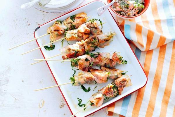salmon skewer with rocket sauce