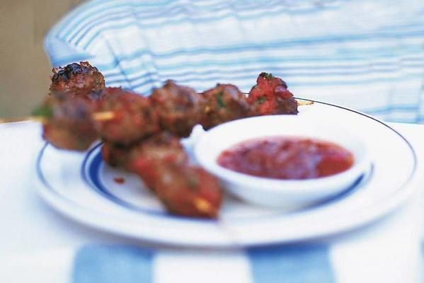 minced meat skewers with blueberry compote